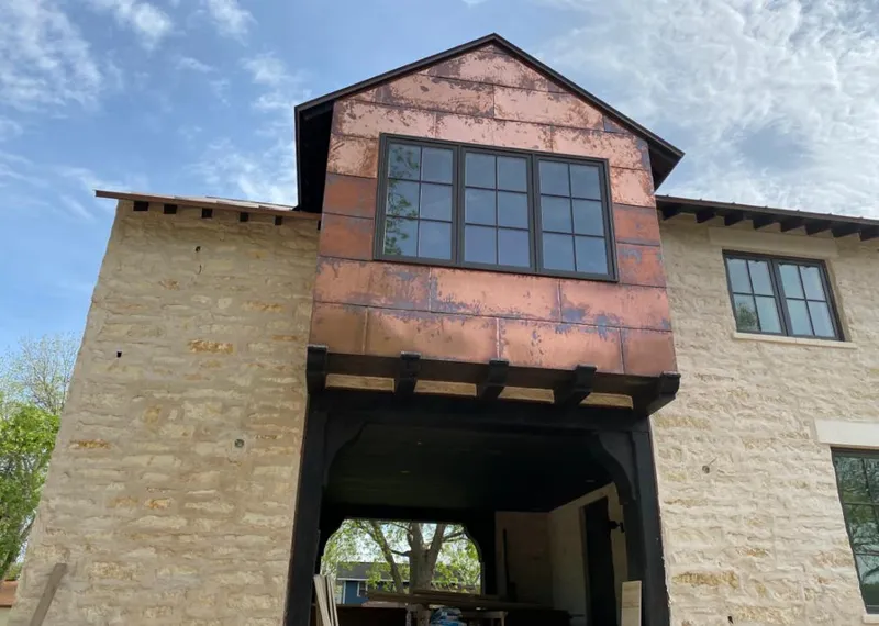 Copper metal panel facade on a stone building for Skylight Installation in Hopkinsville